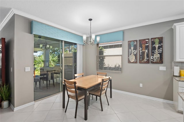 dining area with light tile patterned flooring, ornamental molding, and a notable chandelier