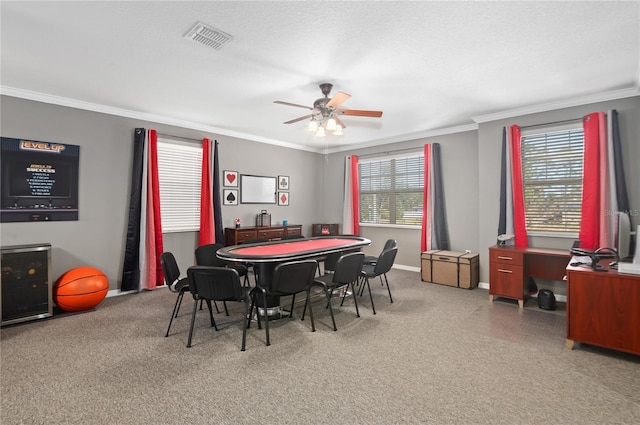 dining area featuring ceiling fan and ornamental molding