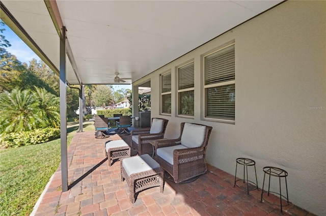 view of patio / terrace featuring ceiling fan and an outdoor living space