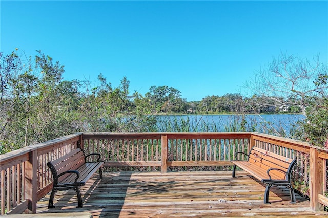 wooden deck featuring a water view