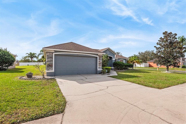 ranch-style home featuring a garage and a front yard