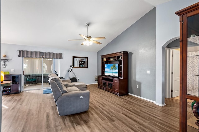 living room with hardwood / wood-style flooring, high vaulted ceiling, and ceiling fan