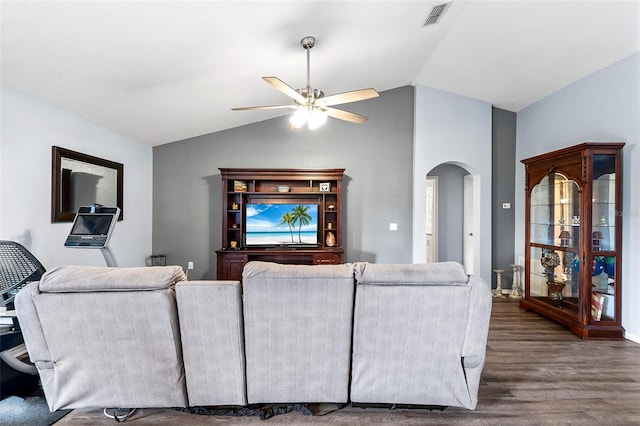 living room featuring hardwood / wood-style flooring, vaulted ceiling, and ceiling fan