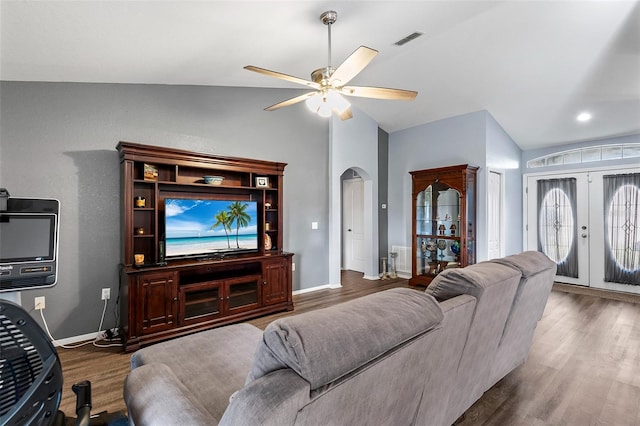 living room with french doors, lofted ceiling, wood-type flooring, and ceiling fan