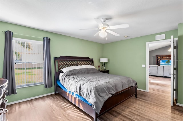 bedroom featuring wood-type flooring and ceiling fan