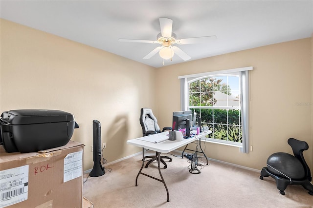 office space with light carpet and ceiling fan