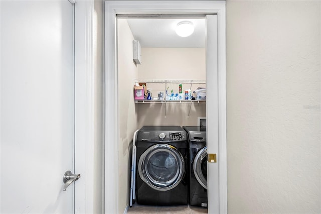 washroom featuring washer and dryer