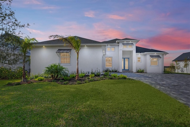 view of front of home with a yard