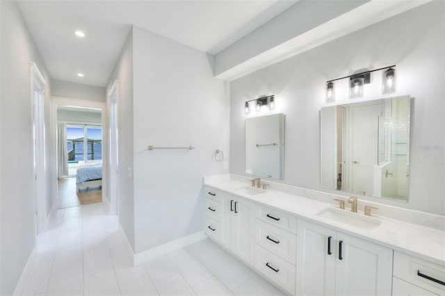 bathroom with tile patterned floors, vanity, and a shower with shower door