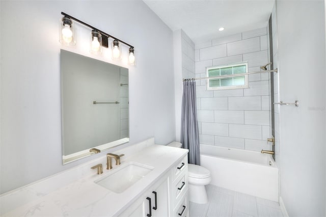 full bathroom with tile patterned flooring, shower / tub combo, vanity, and toilet