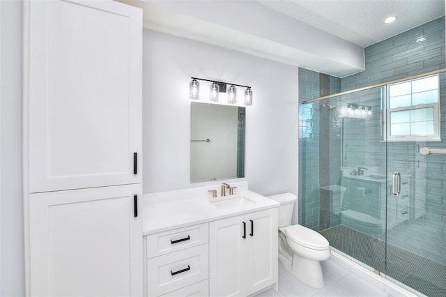 bathroom featuring tile patterned flooring, vanity, toilet, and an enclosed shower