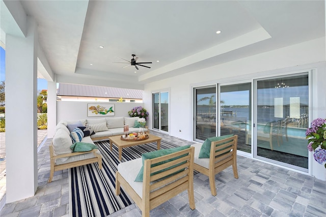 view of patio / terrace with an outdoor living space and ceiling fan