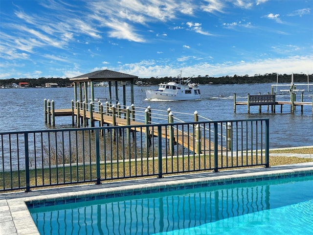 exterior space with a dock and a water view