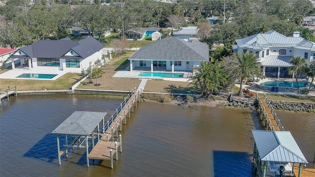 birds eye view of property with a water view