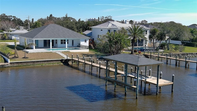 dock area featuring a patio and a water view