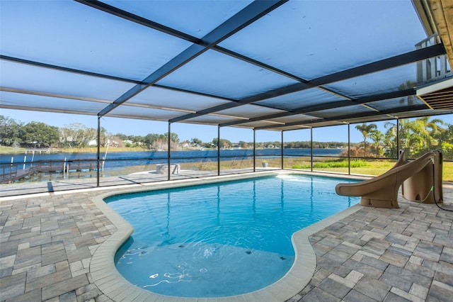 view of swimming pool featuring a lanai, a water view, a patio, and a water slide