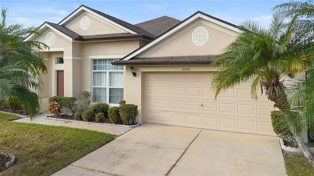 view of front of home with a garage