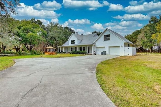 6936 Handcart Rd, Wesley Chapel, FL 33545 - view of front of house with a front lawn
