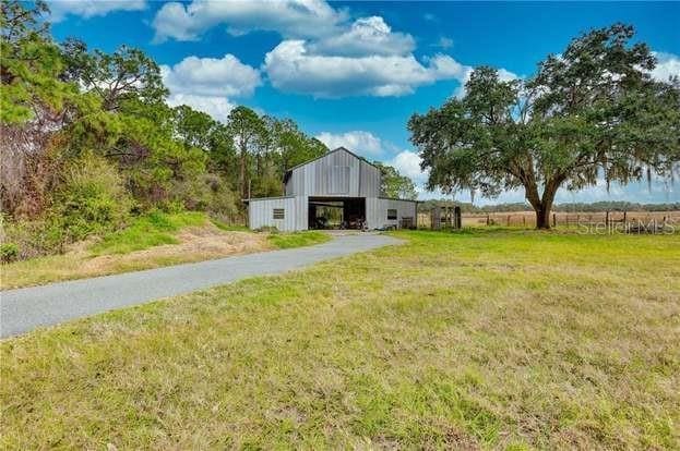 exterior space featuring an outbuilding and a rural view