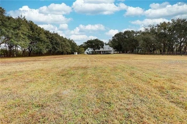 view of yard with a rural view