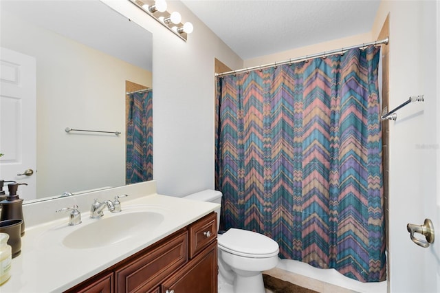 bathroom featuring toilet, vanity, a textured ceiling, and a shower with curtain