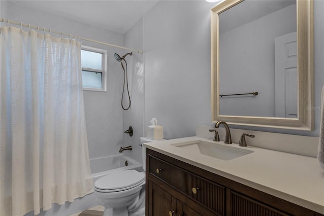 full bathroom with vanity, shower / bath combo, and toilet