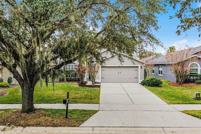 view of front facade with a front yard and a garage