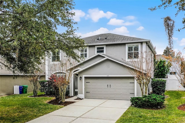 front of property featuring a front yard and a garage