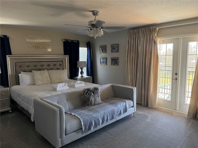 bedroom with ceiling fan, a textured ceiling, access to outside, and carpet flooring