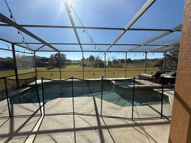 view of swimming pool with a lanai, a yard, a patio, and an in ground hot tub