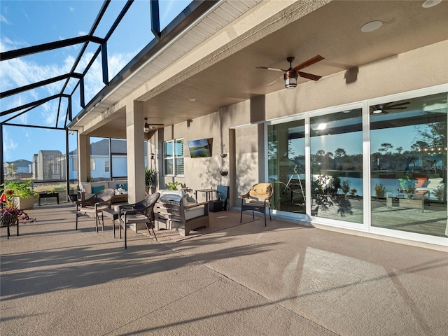 view of patio with a lanai and ceiling fan