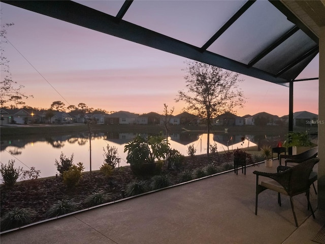 patio terrace at dusk with a water view