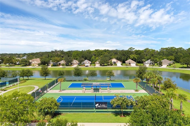 surrounding community featuring a water view and tennis court