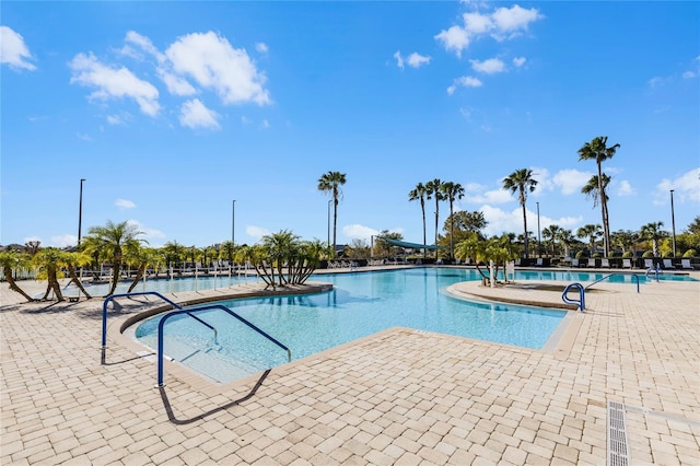 view of swimming pool featuring a patio area