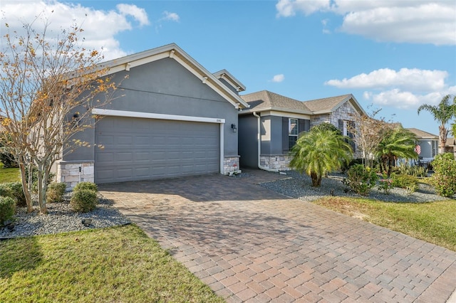 view of front of home featuring a garage and a front lawn