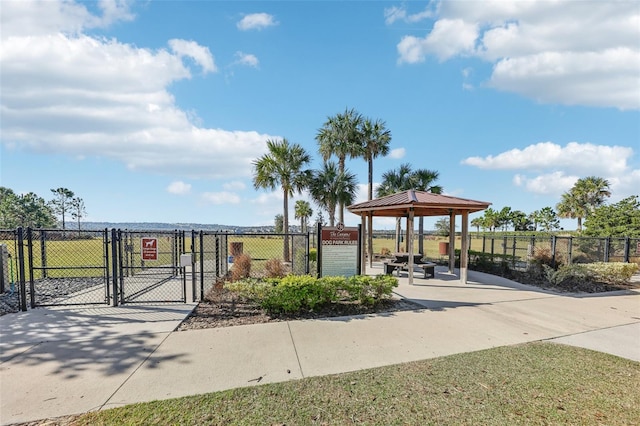 view of community with a gazebo, fence, and a gate