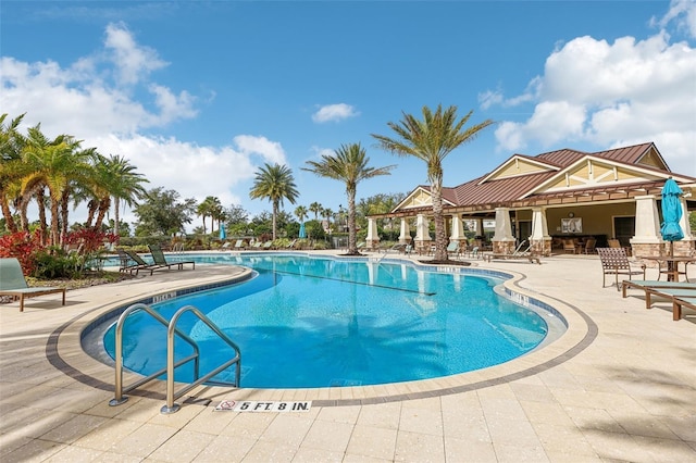 pool with a patio area