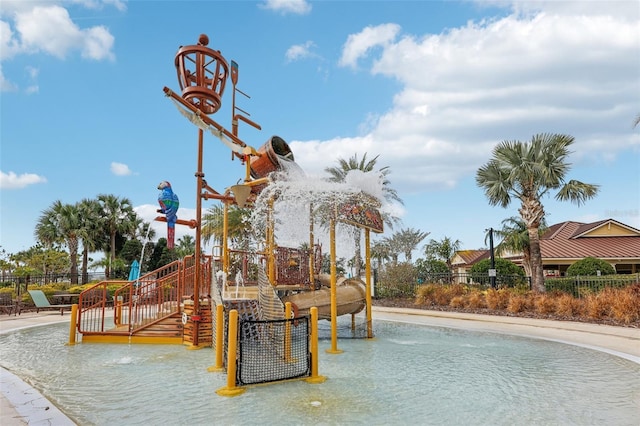 view of jungle gym with fence