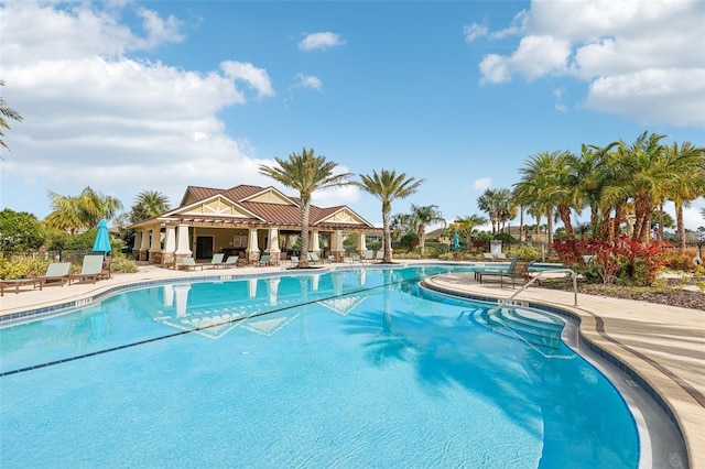 community pool with a patio area