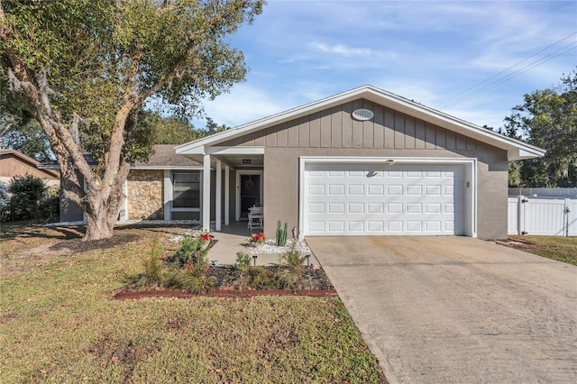 view of front facade with a front lawn and a garage