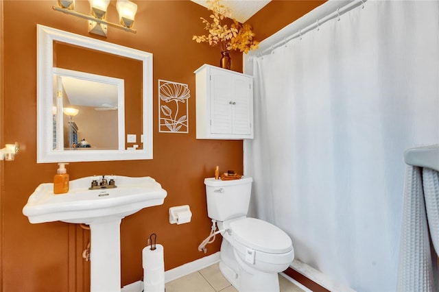 bathroom featuring tile patterned floors and toilet