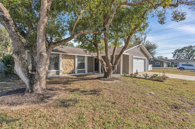 single story home with a front lawn and a garage