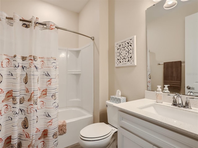 full bathroom with vanity, shower / tub combo, and toilet