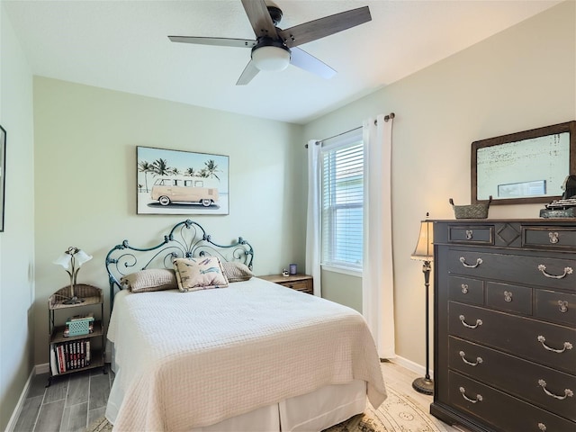 bedroom featuring light hardwood / wood-style floors and ceiling fan