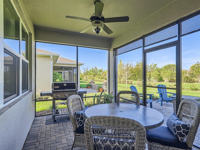 sunroom / solarium with ceiling fan