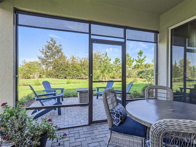 sunroom / solarium featuring plenty of natural light