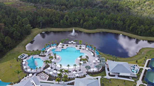 birds eye view of property with a water view