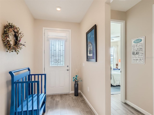 doorway to outside with light hardwood / wood-style flooring