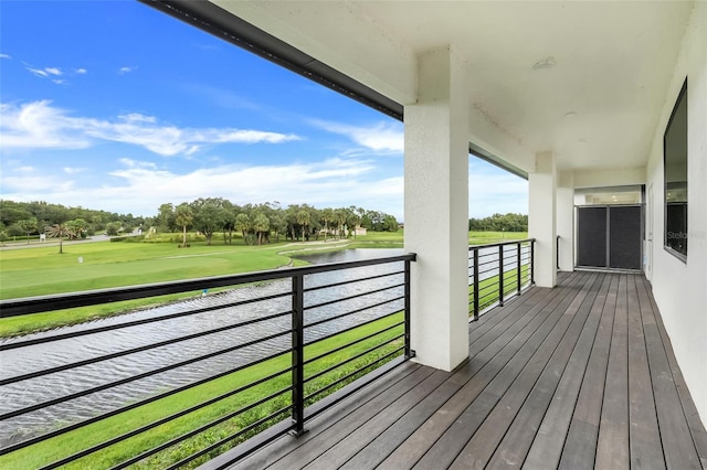 wooden terrace with a water view