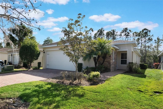 view of front facade featuring a front yard and a garage